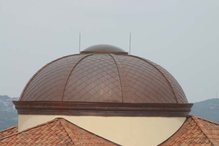 Close-up of a diamond-pattern copper dome roof