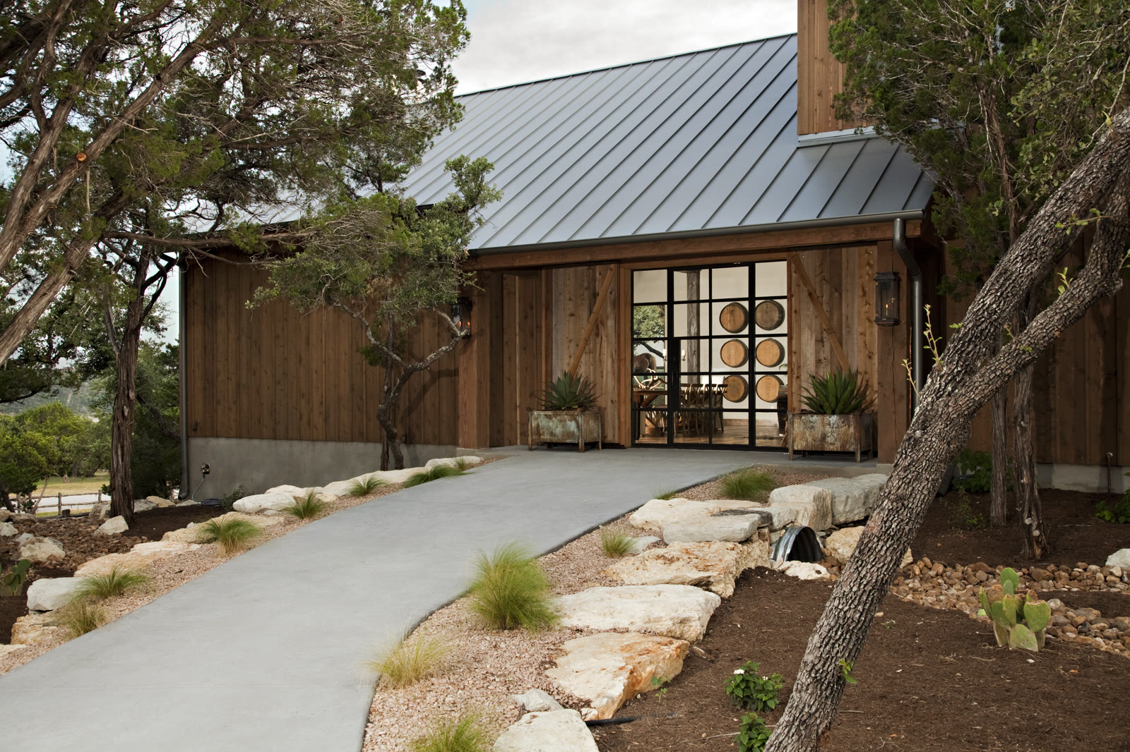 Standing-seam metal roof over a rustic wood entry barn