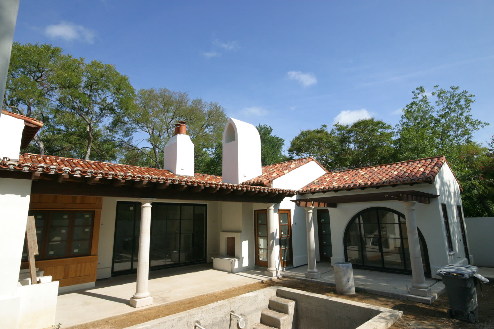 Clay tile roof over a Spanish Colonial courtyard, under construction