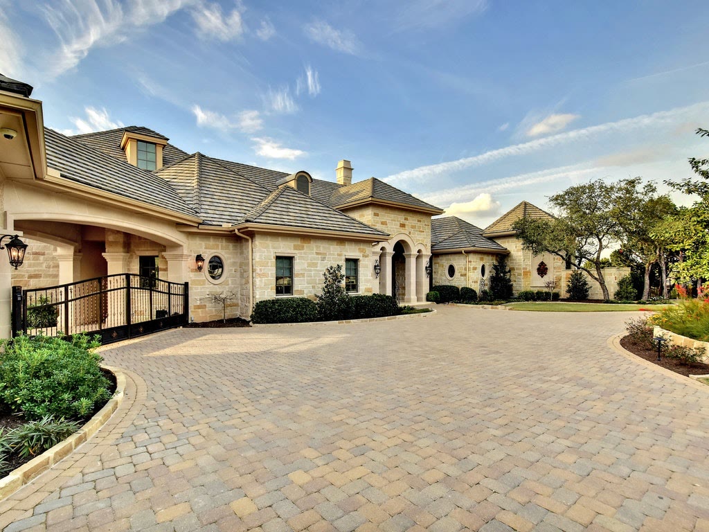 Hill Country estate with a clay and concrete tile roof